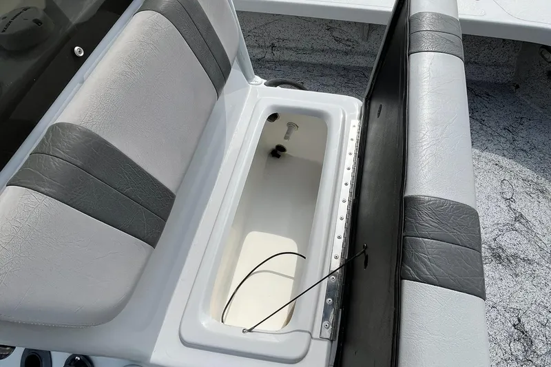 Slide: The Image of 2018 Majek 25 Extreme boat seat with storage compartment open. - 7