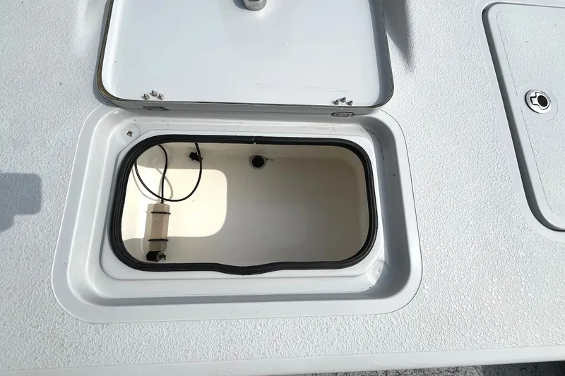 Slide: The Image of 2018 Majek 25 Extreme boat storage compartment with open hatch. - 8