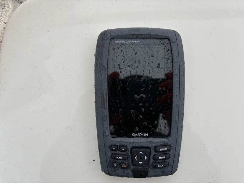 Slide: The Image of Garmin GPS device on a 2014 Carolina Skiff JVX18CC, wet from rain. - 4