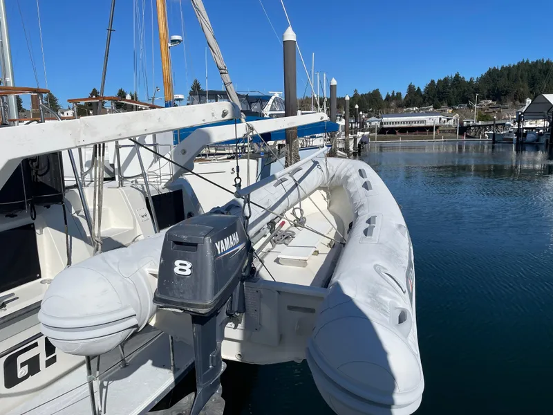 Slide: The Image of 1971 Uniflite 42 DC docked with inflatable boat and Yamaha motor. - 5