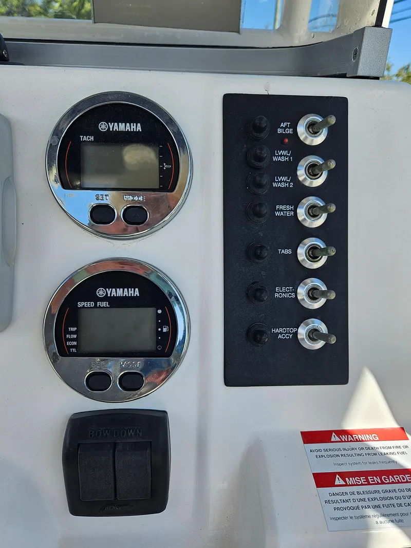 Slide: The Image of Control panel of a 2017 Robalo 222 boat with Yamaha gauges and switches. - 11