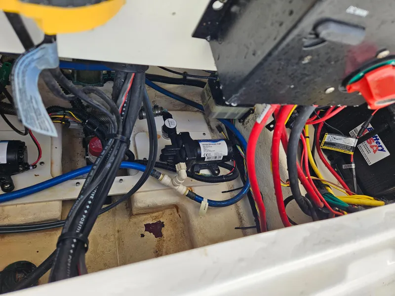 Slide: The Image of 2017 Robalo 222 boat wiring and components in engine compartment. - 13