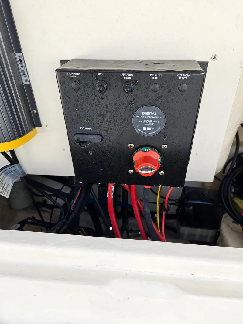 Slide: The Image of Control panel on a 2017 Robalo 222 boat with wiring and switches. - 16