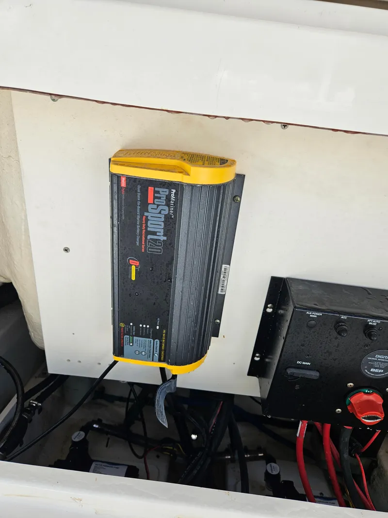 Slide: The Image of 2017 Robalo 222 boat battery charger and electrical panel setup. - 17