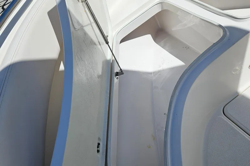 Slide: The Image of Open storage compartment on a 2017 Robalo 222 boat, showcasing interior space. - 23