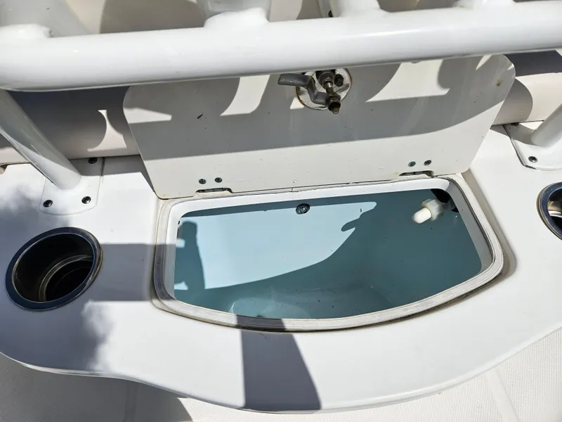 Slide: The Image of Livewell on a 2017 Robalo 222 boat, featuring cup holders and a clean design. - 7