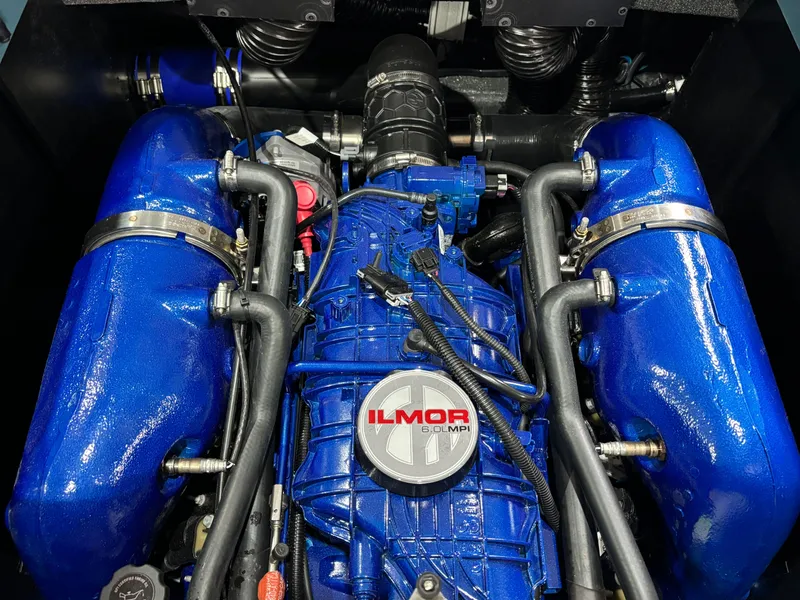 Slide: The Image of 2025 MasterCraft NXT23 engine with blue Ilmor components. - 13