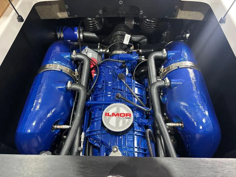 Slide: The Image of 2025 MasterCraft NXT24 engine with blue Ilmor components. - 13