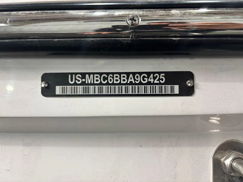 Slide: The Image of 2025 MasterCraft NXT24 boat identification plate with serial number and barcode. - 14