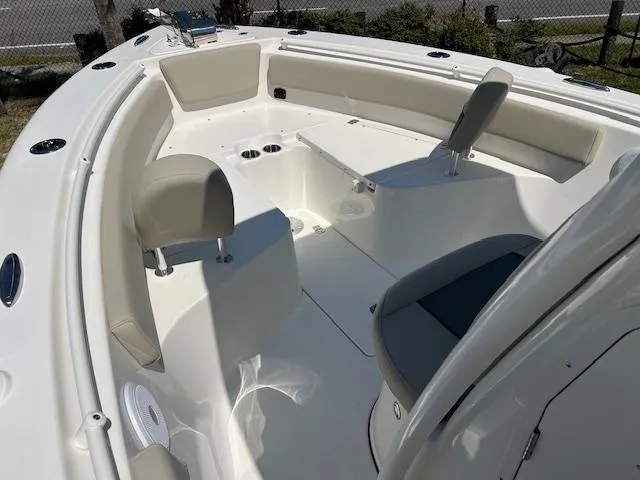 Slide: The Image of 2025 Key West 239 FS boat interior with seating and cup holders. - 10