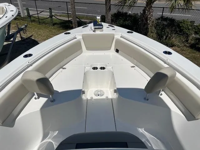 Slide: The Image of 2025 Key West 239 FS boat interior with seating and cup holders. - 12