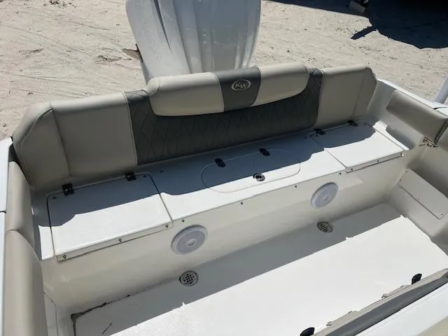 Slide: The Image of 2025 Key West 239 FS boat interior with cushioned seating and storage compartments. - 3