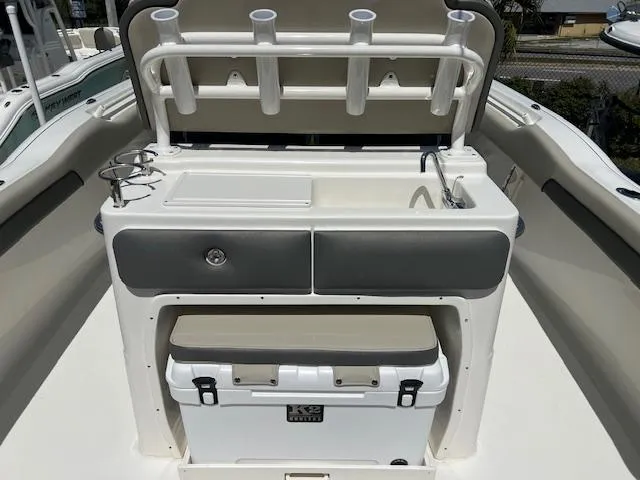 Slide: The Image of 2025 Key West 239 FS boat interior with fishing rod holders and storage compartments. - 4
