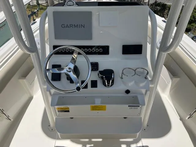 Slide: The Image of 2025 Key West 239 FS boat console with Garmin navigation system and steering wheel. - 6
