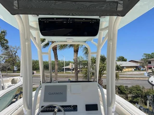 Slide: The Image of 2025 Key West 239 FS boat console with Garmin navigation, palm trees in the background. - 7