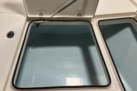 Slide: The Image of 2024 Sea Born FX 21 BAY boat storage compartment with open lid. - 12