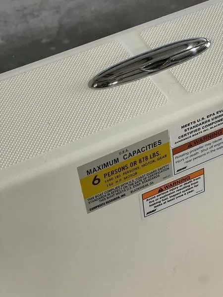 Slide: The Image of 2024 Sea Born FX 21 BAY capacity label, maximum 6 persons or 878 lbs. - 13