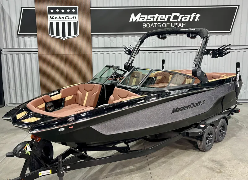 The Image of 2025 MasterCraft XT24 boat with sleek design, displayed at MasterCraft Boats of Utah showroom. - 0