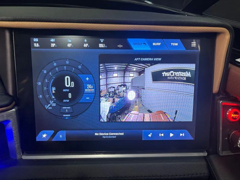 Slide: The Image of 2025 MasterCraft XT24 dashboard display with aft camera view and controls. - 15
