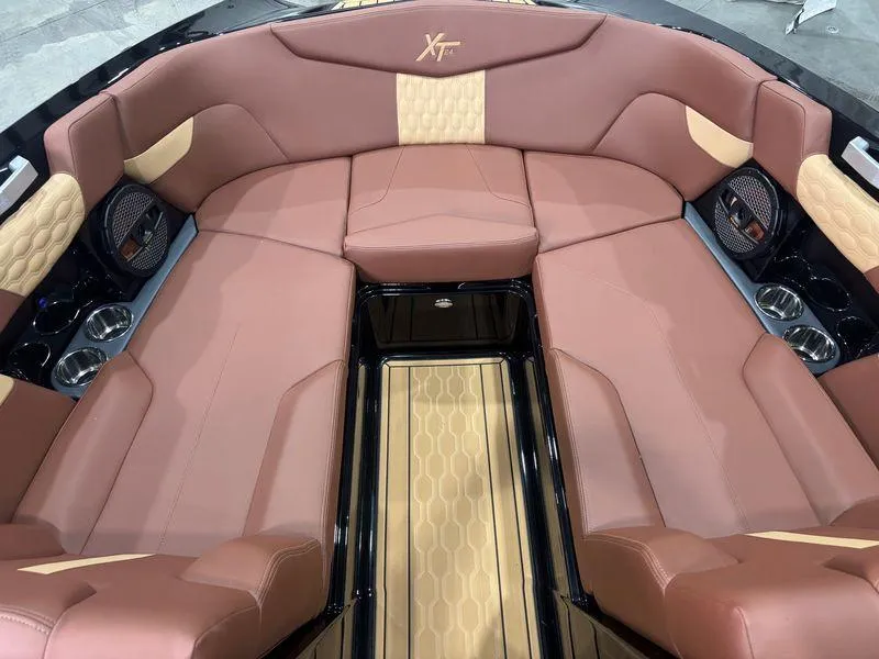 Slide: The Image of 2025 MasterCraft XT24 boat interior with luxurious seating and modern design. - 8