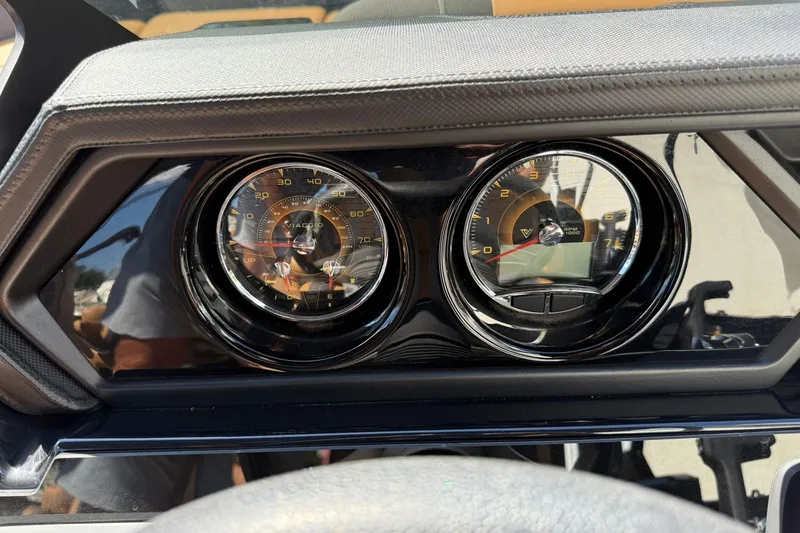 Slide: The Image of Dashboard of 2025 Viaggio Lago X-Q with speedometer and tachometer gauges. - 11