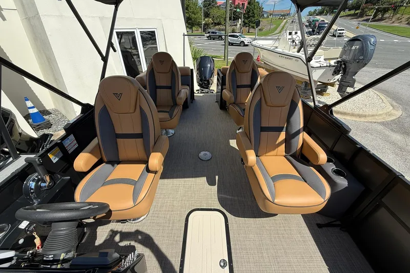Slide: The Image of 2025 Viaggio Lago X-Q boat interior with luxurious tan and gray seating. - 13