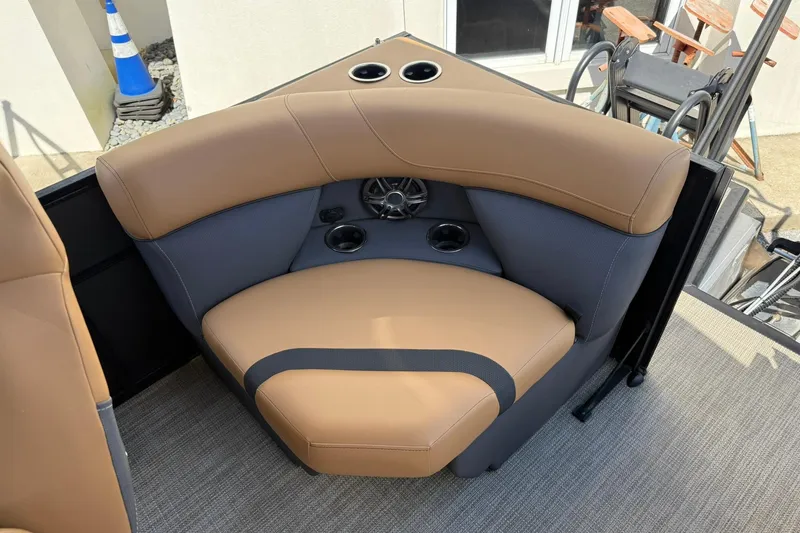 Slide: The Image of Luxurious seating on 2025 Viaggio Lago X-Q boat with cup holders and speaker. - 14