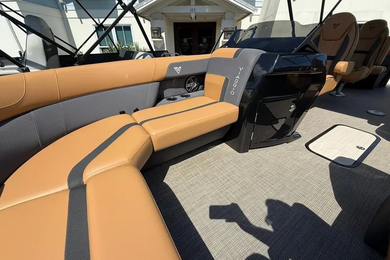 Slide: The Image of Luxurious interior of 2025 Viaggio Lago X-Q boat with tan and gray seating. - 8