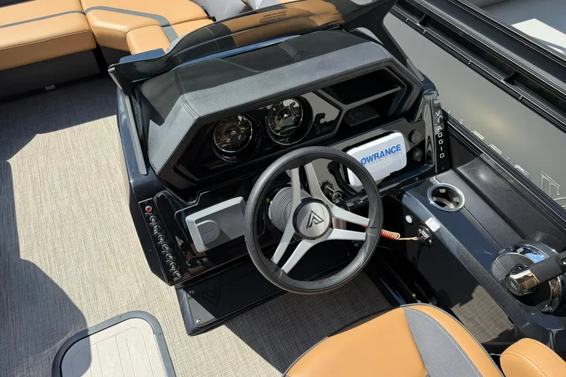 Slide: The Image of Viaggio Lago X-Q 2025 boat dashboard with steering wheel and control panel. - 9