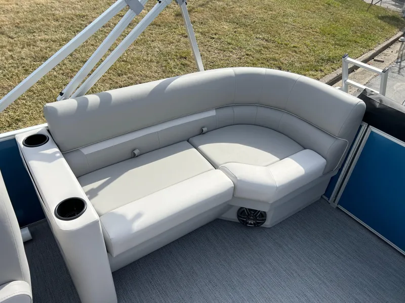 Slide: The Image of 2025 Godfrey Xperience Split Bench with cup holders on a boat deck. - 12