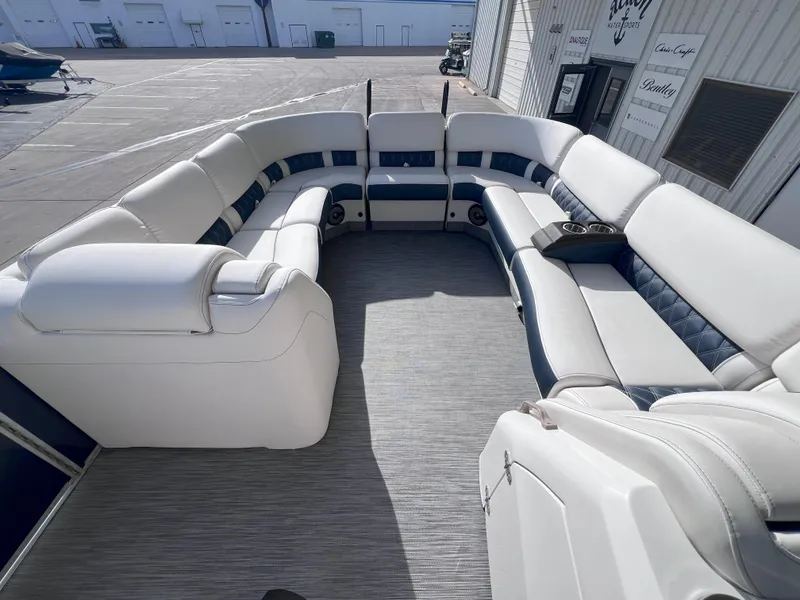 Slide: The Image of 2022 Bennington 25RSB pontoon boat with spacious seating and modern design. - 12