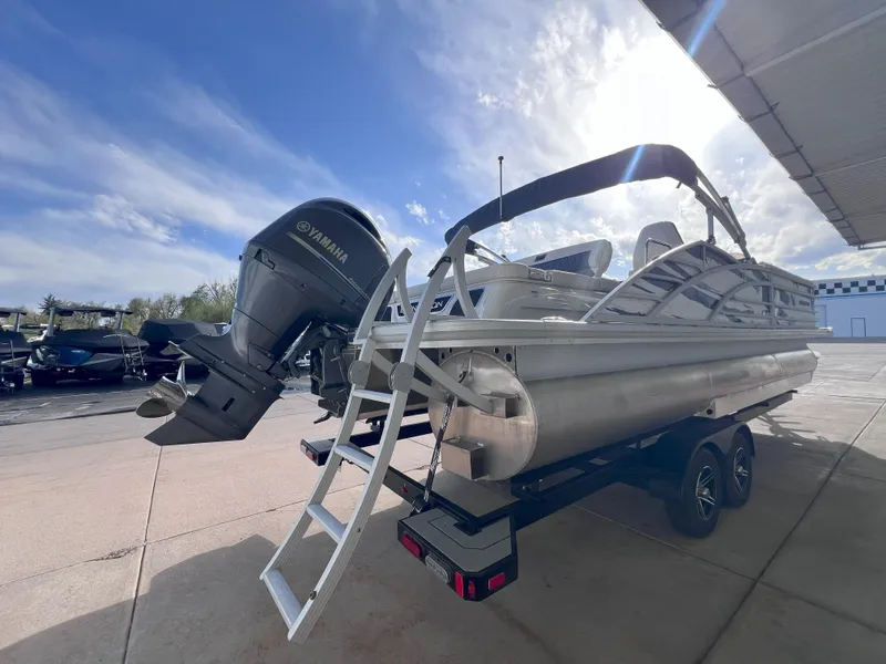 Slide: The Image of 2022 Bennington 25RSB pontoon boat with Yamaha outboard motor on trailer. - 5