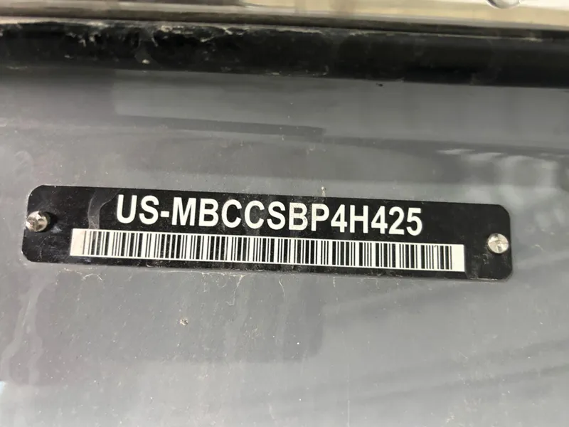 Slide: The Image of 2025 MasterCraft XT23 boat identification plate with serial number and barcode. - 14