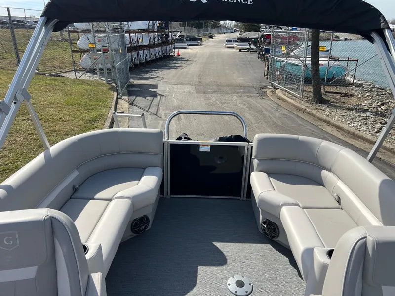 Slide: The Image of 2025 Godfrey Xperience Split Bench boat with spacious seating and waterfront view. - 12