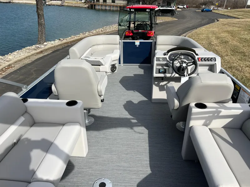 Slide: The Image of 2025 Godfrey Xperience Split Bench boat with spacious seating and modern steering console. - 13