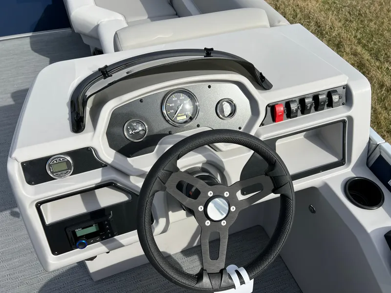 Slide: The Image of Steering console of 2025 Godfrey Xperience Split Bench boat with modern controls. - 15