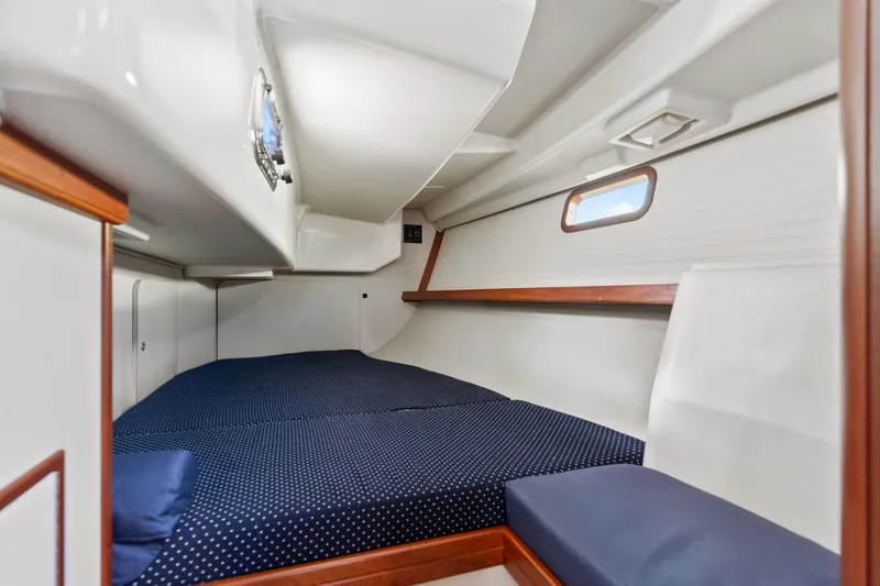 Slide: The Image of Cozy cabin interior of 2015 Blue Jacket 40 sailboat with polka dot bedding. - 22
