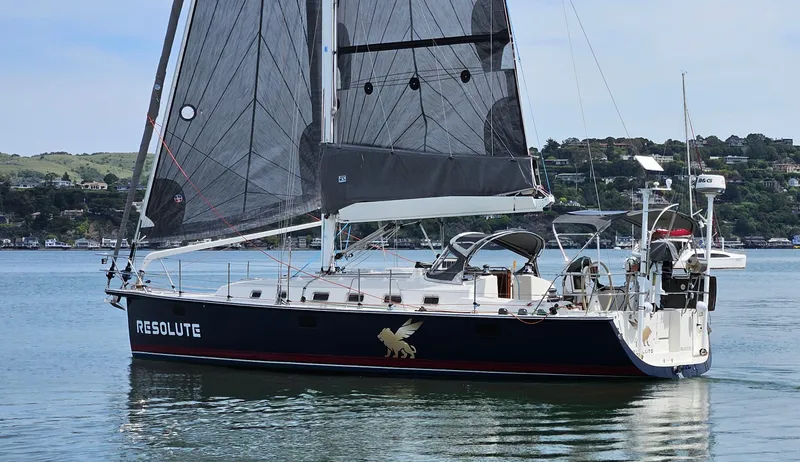Slide: The Image of Sailboat "Resolute" on calm water, Blue Jacket 40 model, 2015. - 5