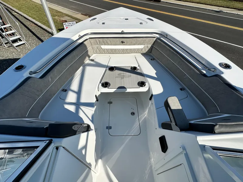 Slide: The Image of 2025 Sea Pro 240 Dual Console boat interior with seating and storage compartments. - 15