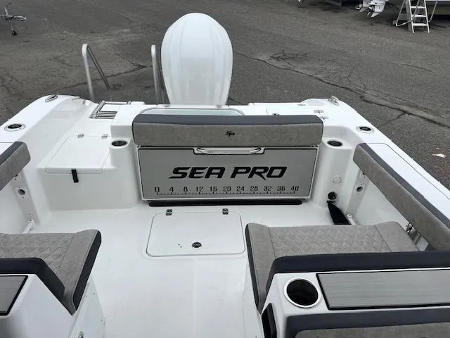 Slide: The Image of 2025 Sea Pro 240 Dual Console boat interior with seating and storage. - 17