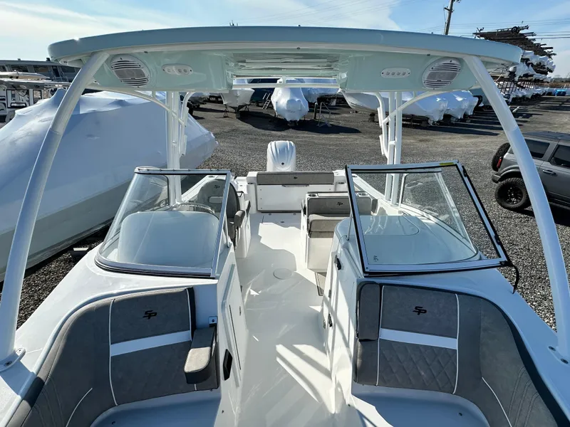 Slide: The Image of 2025 Sea Pro 240 Dual Console boat interior with open seating and modern design. - 18