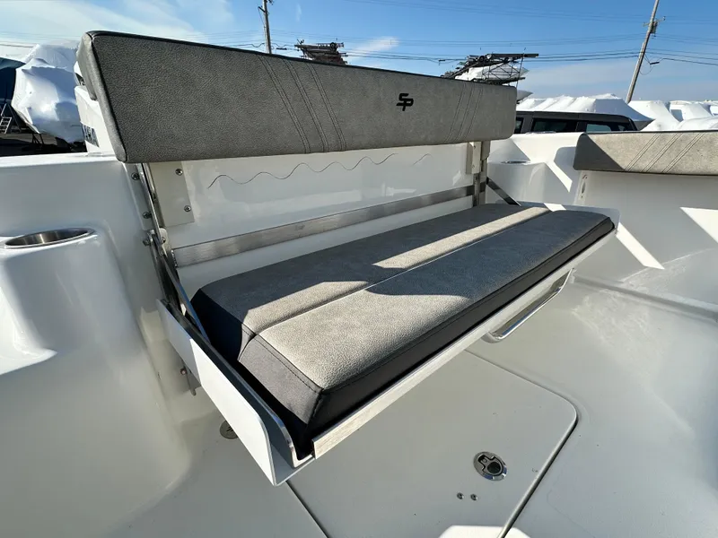 Slide: The Image of 2025 Sea Pro 240 Dual Console boat seat with gray upholstery and sleek design. - 19