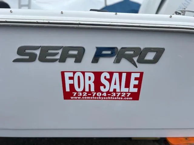 Slide: The Image of 2025 Sea Pro 240 Dual Console boat for sale sign with contact details. - 2