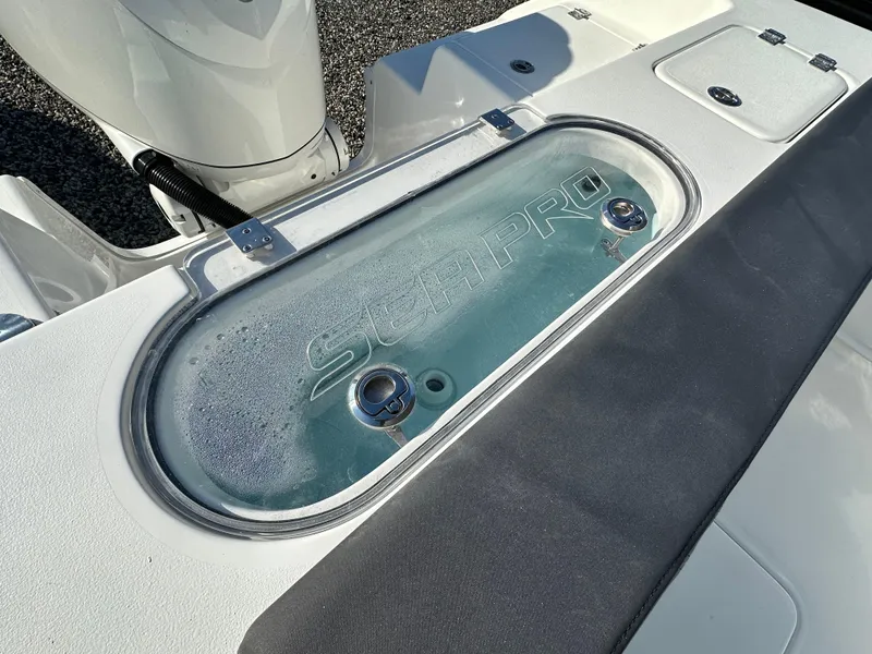 Slide: The Image of 2025 Sea Pro 240 Dual Console boat livewell with logo, showcasing sleek design. - 22