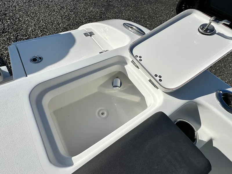 Slide: The Image of 2025 Sea Pro 240 Dual Console boat with open storage compartment. - 24