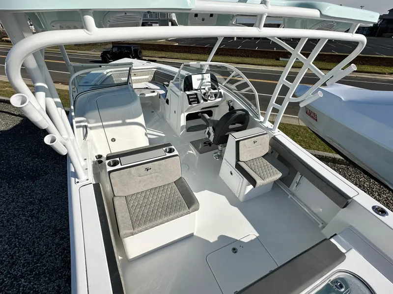 Slide: The Image of 2025 Sea Pro 240 Dual Console boat interior with modern seating and helm. - 4