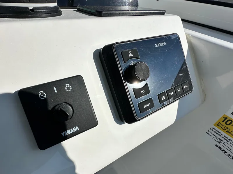 Slide: The Image of Control panel of 2025 Sea Pro 240 Dual Console boat with Yamaha and audio system. - 9