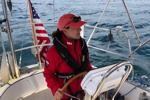 Slide: The Image of Person steering 1986 Mason 33 sailboat on open sea. - 11