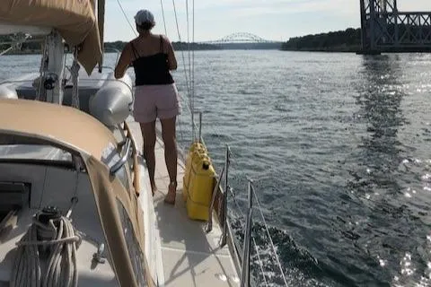 Slide: The Image of Person on 1986 Mason 33 sailboat on a river. - 15