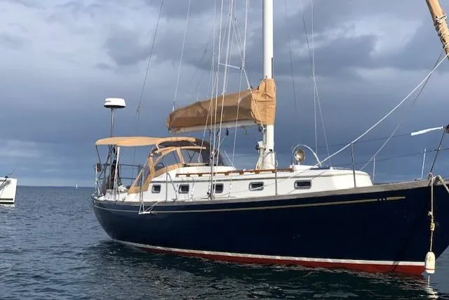 Slide: The Image of 1986 Mason 33 sailboat on calm waters. - 2